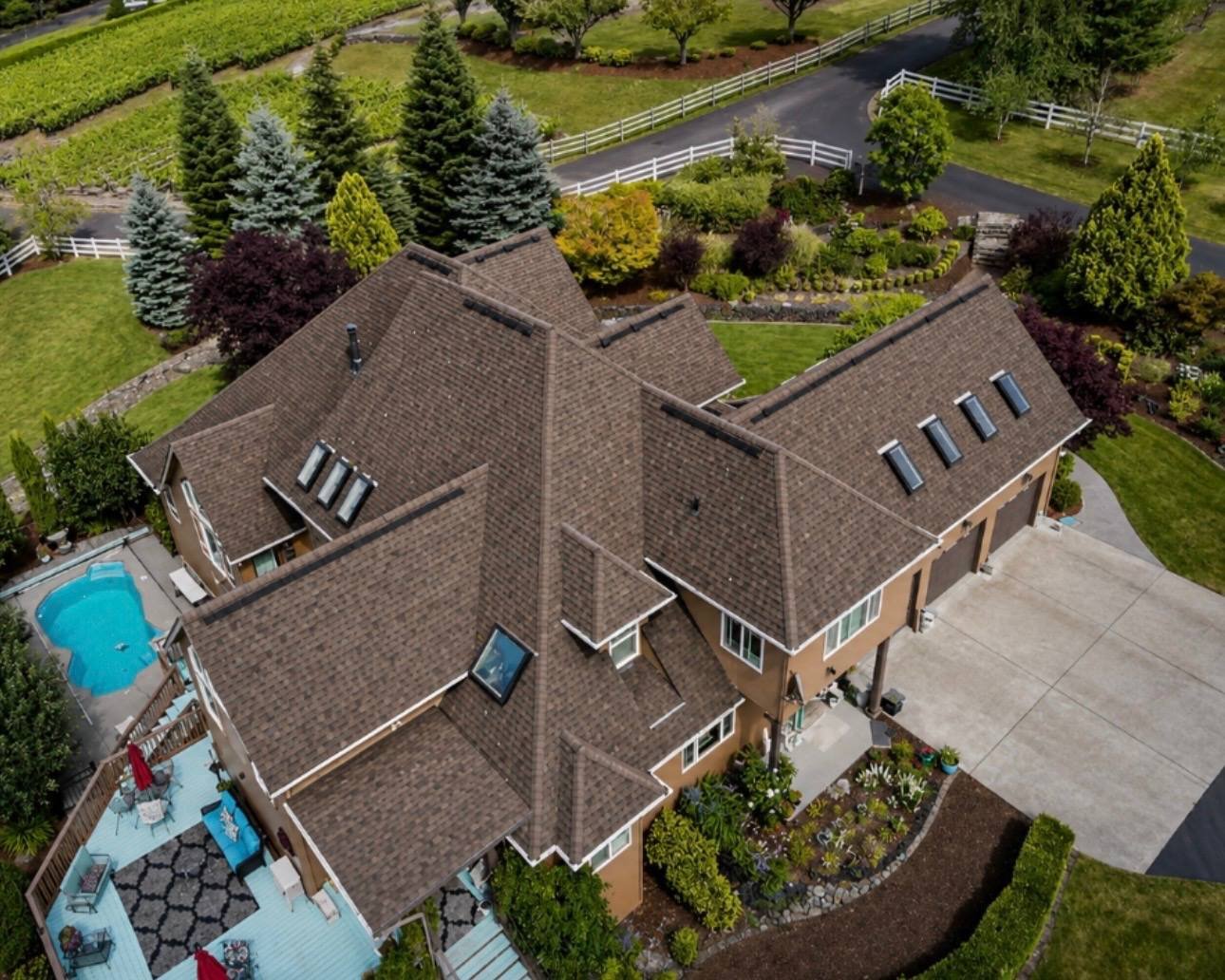 The same house after the roof was replaced, with new brown shingles
