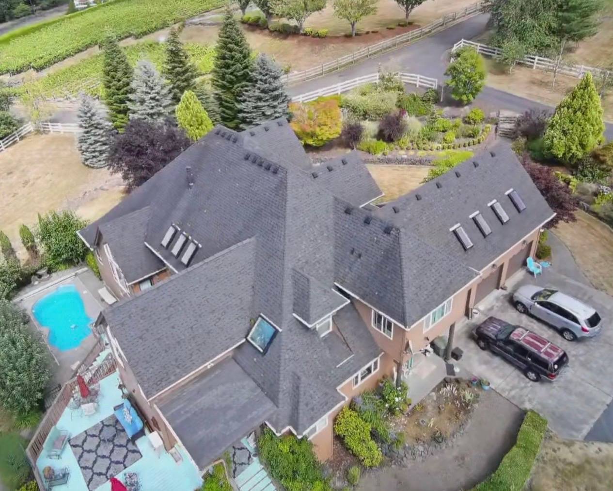 The same house before the roof was replaced, with the original dark shingles