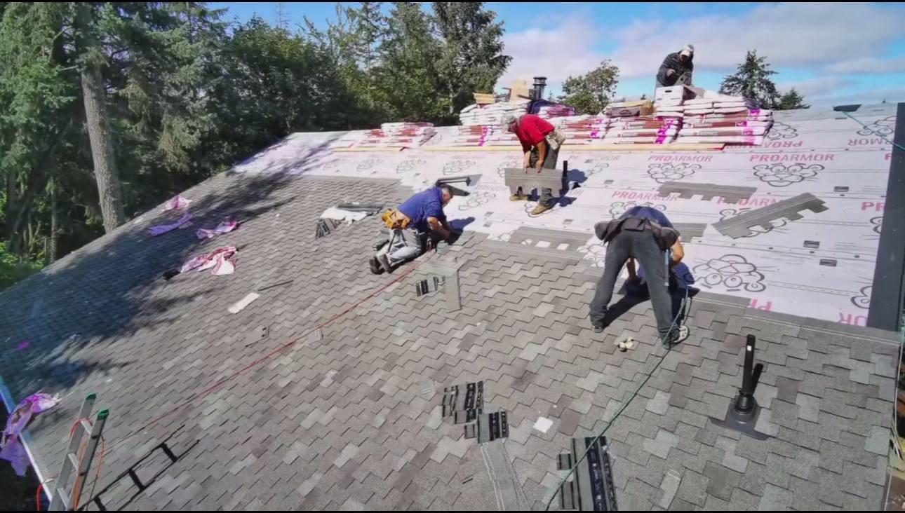 Crew working on a roof during a tear off